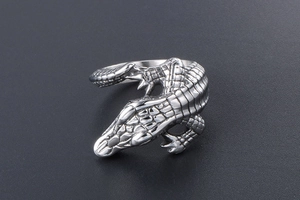 Macro shot of realistic crocodile ring showing 3D textured scales and silver finish