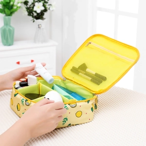 Detail of yellow lemon cosmetic bag with internal mesh pocket and organized compartments