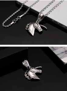 Detail of silver unicorn pendant made of stainless steel with a textured twist chain