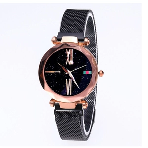 Detail of starry sky dial watch with rose gold case and black mesh magnetic band