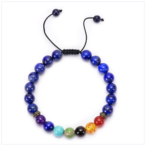 Detail of adjustable woven knot on a beaded chakra bracelet with natural stones
