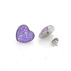 Close-up of heart-shaped stainless steel earrings with purple druzy stone setting