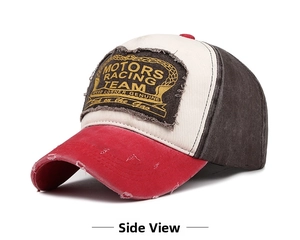 Detail showing distressed holes and Motors Racing Team patch on a vintage baseball cap