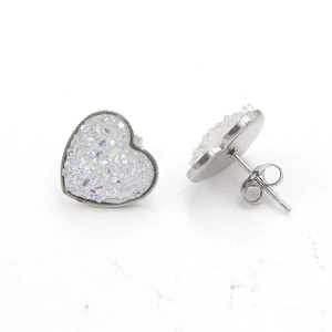 Detail view of heart-shaped stainless steel druzy stud earrings with silver butterfly backing