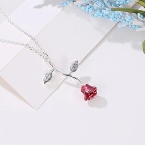Elegant red enamel rose pendant necklace on silver chain for romantic gift giving