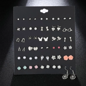 Set of assorted colorful heart and bow stud earrings with sparkling cubic zirconia accents