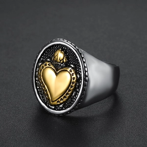 Vintage stainless steel sacred heart ring with golden crown detail on silver band