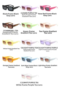 Flat lay showing thirteen different colored rectangular sunglasses with decorative metal rivets