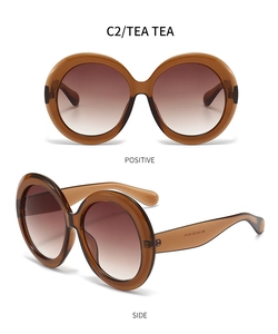 Vues détaillées de lunettes de soleil rondes oversize ambre avec verres dégradés thé