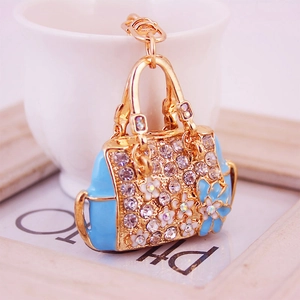 Elegant gold and blue flower handbag keychain pendant with sparkling rhinestones