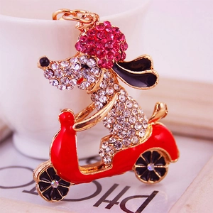 Cartoon dog on red motorcycle keychain with pink rhinestones and enamel metal finish