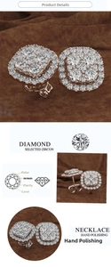Macro detail of square halo stud earrings with brilliant zircon stones in gold and silver