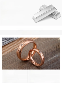 Detail view of rose gold titanium steel couple rings with embedded cubic zirconia stones