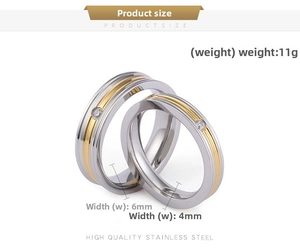 Detail of two-tone stainless steel couple rings with gold inlay and small cubic zirconia