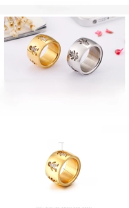 Detail view of 12mm stainless steel ring with cutout boy and girl motif and zircon stones