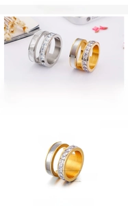 Detail view of 14mm stainless steel rings featuring shell inlay and zircon stones