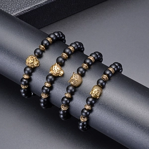 Set of four 8mm black matte beaded stretch bracelets with gold lion, leopard and owl charms