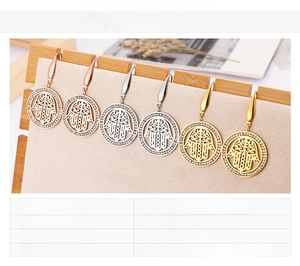 Detailed view of Hamsa Hand stud earrings in gold, rose gold and silver stainless steel