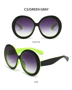 Vue détaillée de face et de profil de lunettes de soleil rondes noir et vert fluo