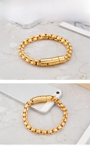 Detail of gold titanium steel curb chain bracelet with industrial grooved clasp