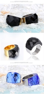 Detail of faceted crystal rings with gold and silver metal finish on white lace