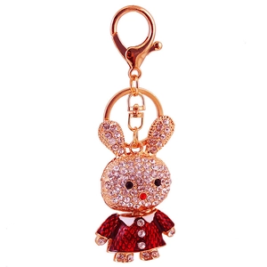 Creative gold metal keychain with a cute red dress bunny rabbit encrusted in sparkling rhinestones