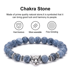 Natural weathered agate chakra bracelet featuring a detailed leopard head charm on beads