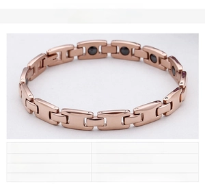 Detail view of rose gold stainless steel magnetic health bracelet with black therapy magnets