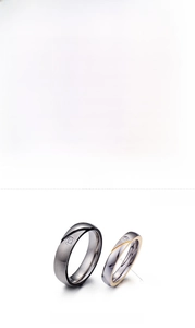 Detailed size chart for stainless steel couple rings with black and gold wave design