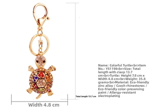 Close-up of a colorful turtle keychain showing precise 13.7cm length and size measurements