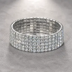 Detailed macro view of multi-layer silver-tone elastic bracelet with sparkling crystal rows