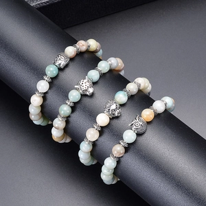 Set of 4 natural stone bead bracelets with vintage owl lion leopard and buddha head charms