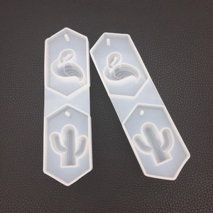 Detail view of hex silicone molds featuring flamingo and cactus shapes for DIY crafts