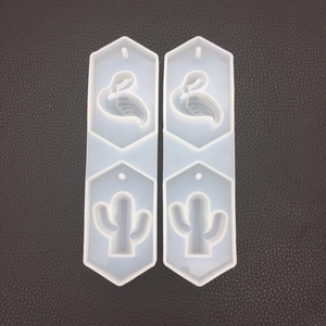 Macro view of transparent silicone flamingo and cactus molds for DIY resin pendants