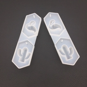 Macro detail of silicone molds featuring flamingo and cactus patterns for DIY resin crafts