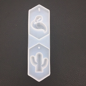 Macro view of a long hexagonal silicone mold for flamingo and cactus shaped pendants