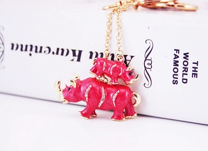 Close-up of pink rhino keychain with sparkling rhinestones and gold-plated details