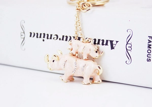 Close-up of pink enamel rhino mother and baby keychain with sparkling crystals