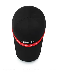 Detail view of black cotton baseball cap with red embroidered strap and Peace lettering