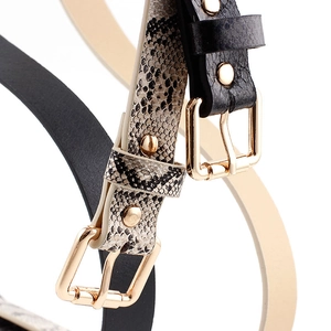 Women's thin PU leather belts in beige snake pattern and solid black with gold buckles