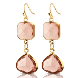 Detail of pink crystal teardrop earrings with gold hooks and faceted square stones