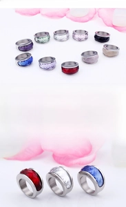 Macro shot of colorful crystal stones set in high quality stainless steel rings