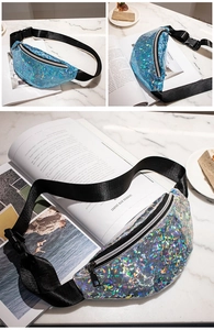 Detail view of geometric laser sequin waist bag with adjustable strap and metallic zipper