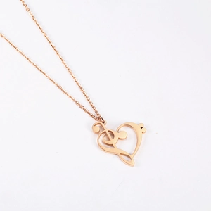 18K rose gold necklace with heart and musical note pendant on a clean white background