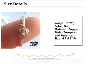 Detailed view of gold honeybee ring with hammered texture and 0.8cm width specifications