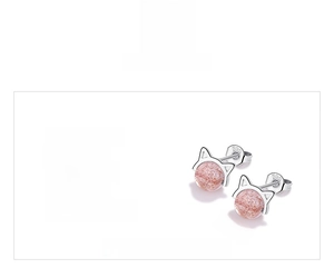 Detailed view of 8.3mm cat-shaped silver earrings with strawberry crystal studs