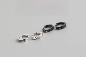 Detail of twisted 9mm silver and black hoop earrings showing 1.6g weight and size