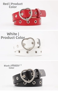 Detailed close-up of thin faux leather belts with heart buckles in red, white and black