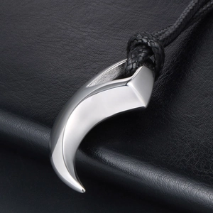 Polished silver crescent tooth pendant on black cord necklace for men and women