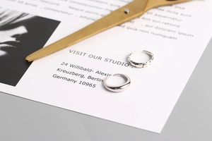 Detail of S925 sterling silver rings showing smooth water drop design and braided texture